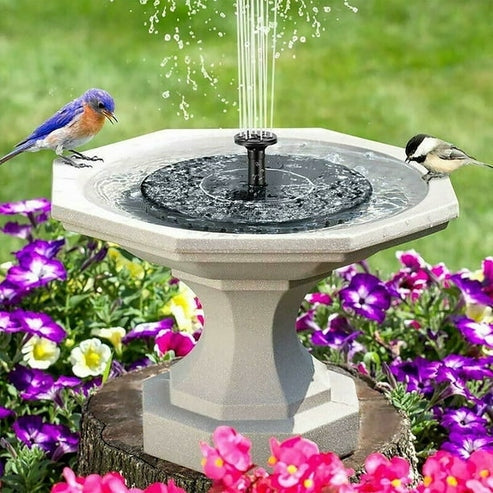 Fuente de agua más flores